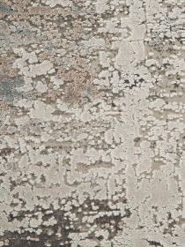 Textilmuster zeigt abstrakte, unregelmäßige Flecken in Beige, Grau und Braun auf hellem Grund.
