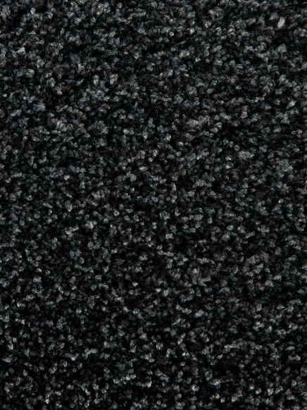 Dichte, schwarze Teppichstruktur mit kurzen, eng aneinandergereihten Fasern in Innenraum.