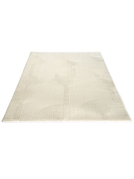 Teppich liegt flach mit geometrischem Muster aus Halbkreisen und Linien in hellem Ton.