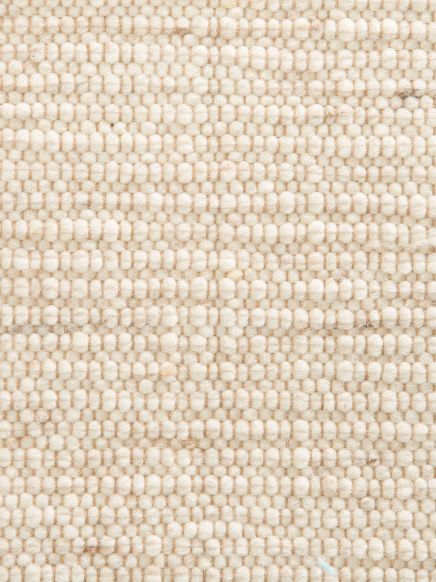 Nahaufnahme eines gewebten Stoffes mit kleinem, quadratischem Muster in hellem Beige.