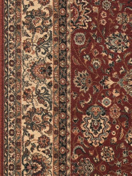 Teppich mit floralem, ornamentalem Muster in Rot, Beige und Dunkelgrün, Nahtstelle sichtbar.