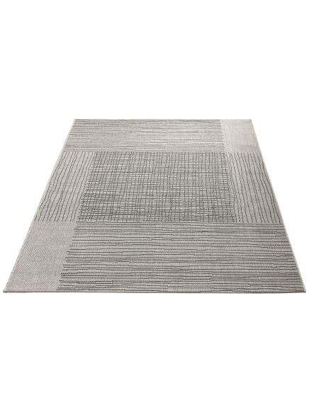 Teppich liegt flach mit quadratischen Feldern, die verschiedene Linienmuster in Grau tonen zeigen.