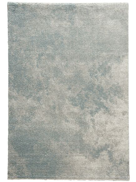 Teppich liegt flach, zeigt unregelmäßiges Muster in Blau- und Beigetönen ohne Text.