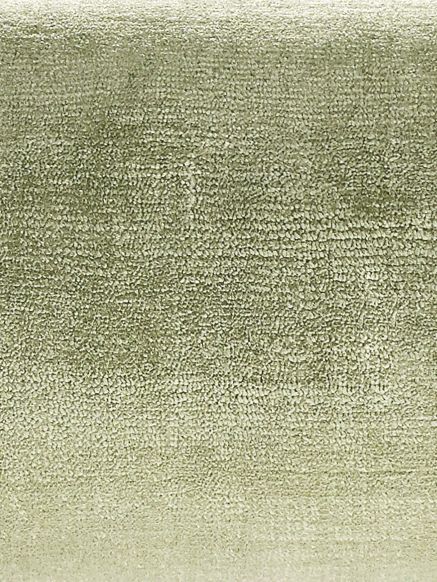 Grün-grauer samtartiger Stoff mit feiner, strukturierter Oberfläche.