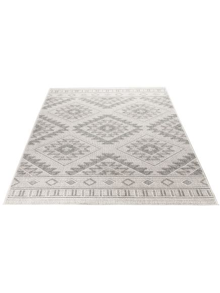 Teppich liegt flach mit geometrischem Muster, hellgraue und weiße Farben, isoliert auf weißem Hintergrund.