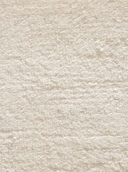 weißer Teppich mit weicher, flauschiger Textur in Nahaufnahme ohne weiteren Kontext