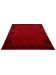 Roter Teppich liegt flach, mit dunkleren quadratischen Mustern an den Enden, minimalistisch.