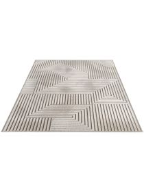Teppich zeigt geometrisches Muster mit Linien und Rechtecken in hellem Raum.