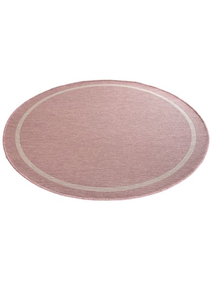 Runder Teppich liegt flach, rosa Farbton mit hellem Ringmuster, auf weißem Hintergrund.