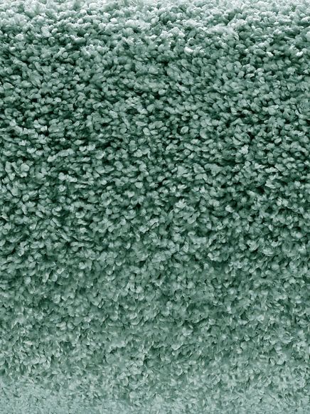 weicher Teppich zeigt dichter Flor in grünlicher Farbe Nahaufnahme